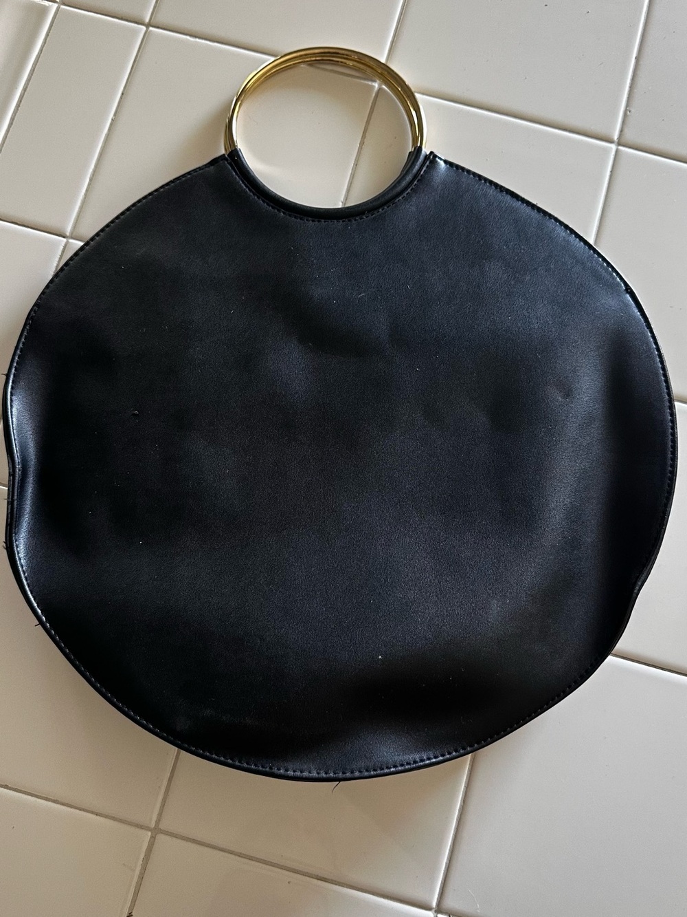 Express Black Round Bag with Gold Handles and Optional Chain Accent